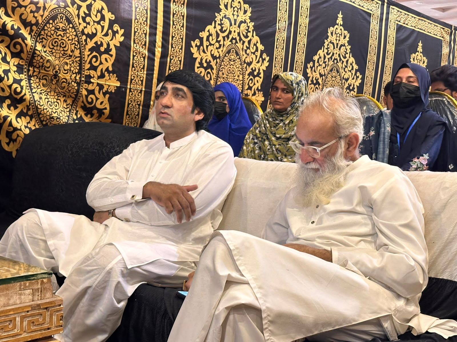 A display showcases Peace Welfare Organization's community work.