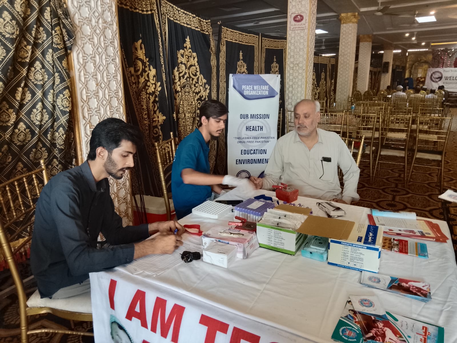 The PWO medical team registers guests at the free health screening desk during the conference.